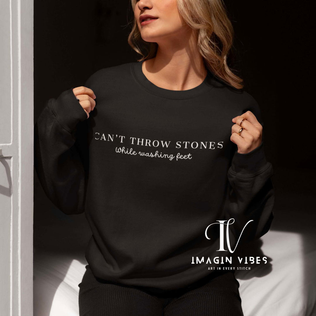 Minimalist Christian Unisex Sweatshirt 'Can't Throw Stones While Washing Feet' Sweatshirt Printify L Black