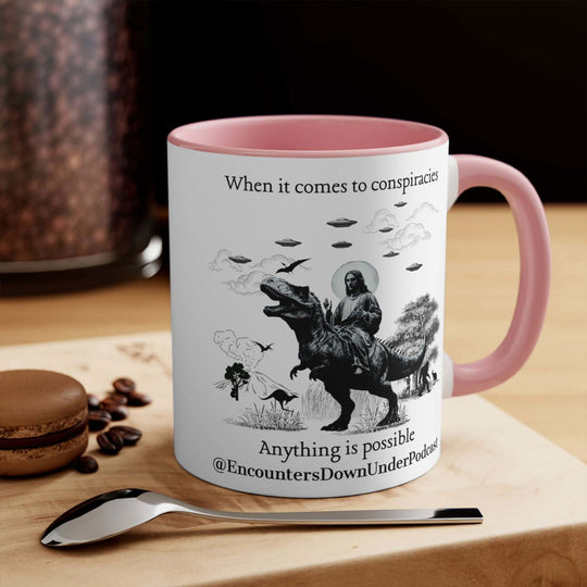 Encounters Down Under Podcast Supporting UFO Mug - Jesus Riding Dinosaur Mug Printify 11oz Pink