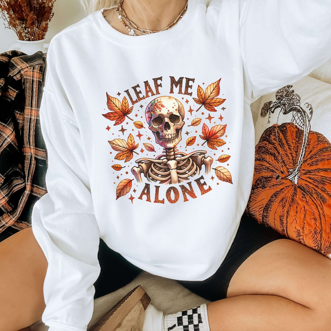 Leaf Me Alone: Skeleton Halloween Sweatshirt Sweatshirt Printify