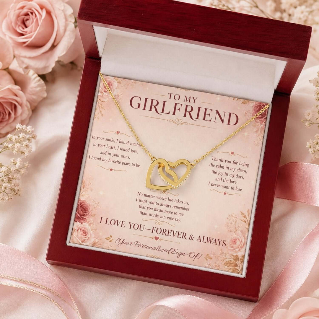 Interlocking hearts necklace for girlfriend displayed in a gift box with a heartfelt message card.