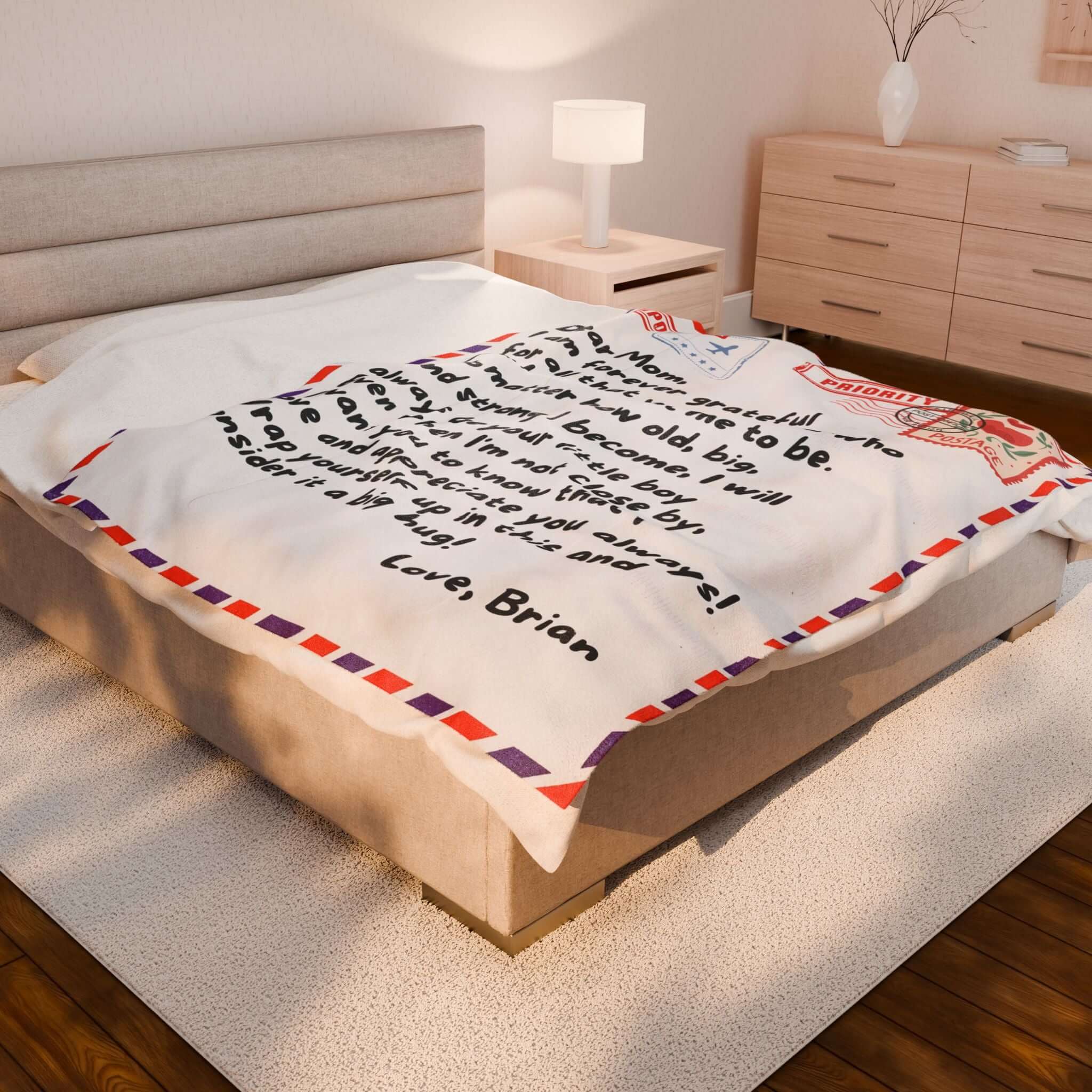 Personalized Blanket on a bed featuring a heartfelt letter design from a son to his mother.