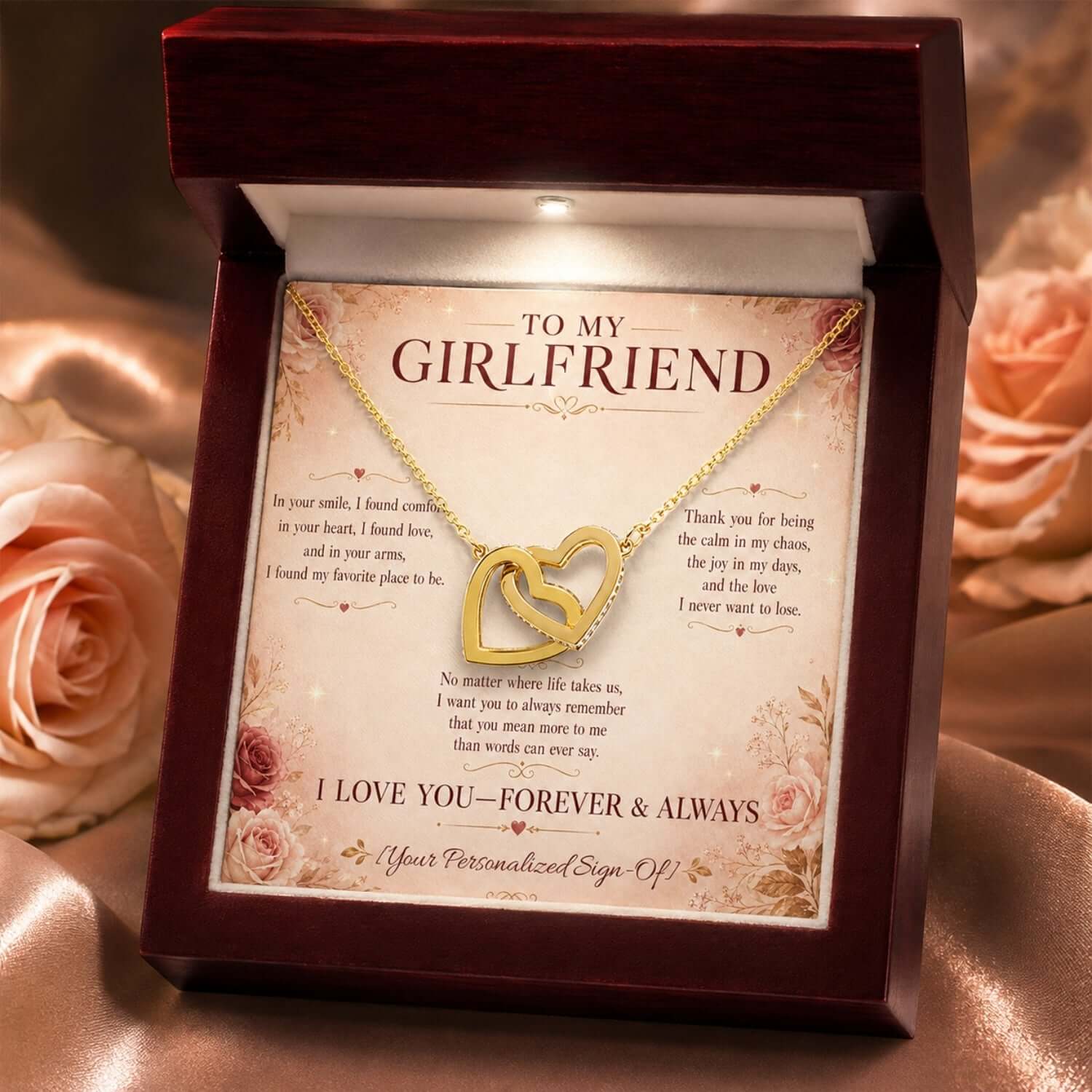 Interlocking hearts necklace for girlfriend displayed in a gift box with a heartfelt message card.