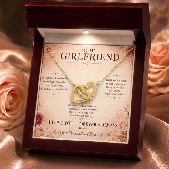 Interlocking hearts necklace for girlfriend displayed in a gift box with a heartfelt message card.