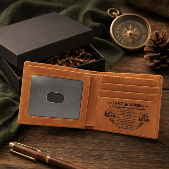 Engraved wallet for grandson placed next to a gift box, featuring a heartfelt message inside.