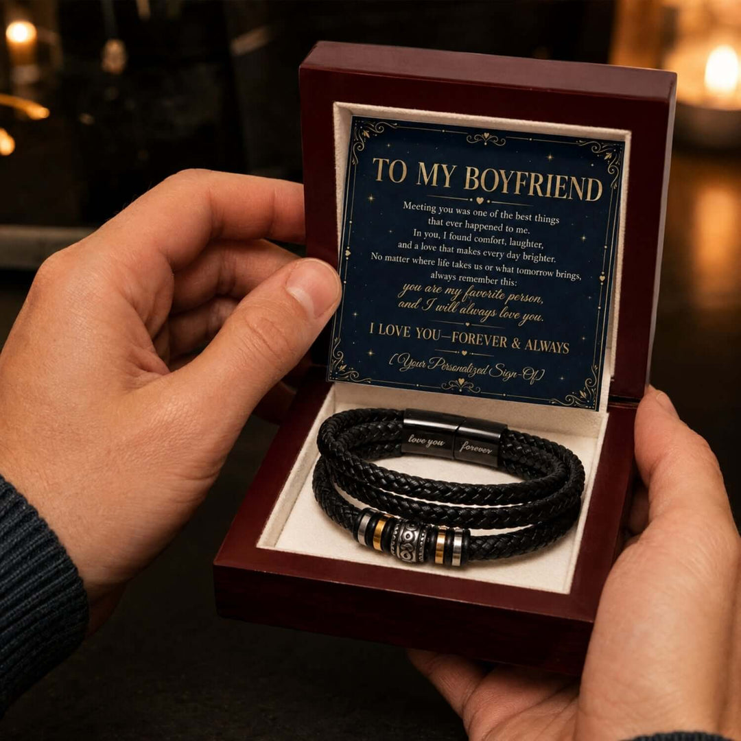 A person holding a meaningful boyfriend bracelet gift in a beautiful box with a heartfelt message card.