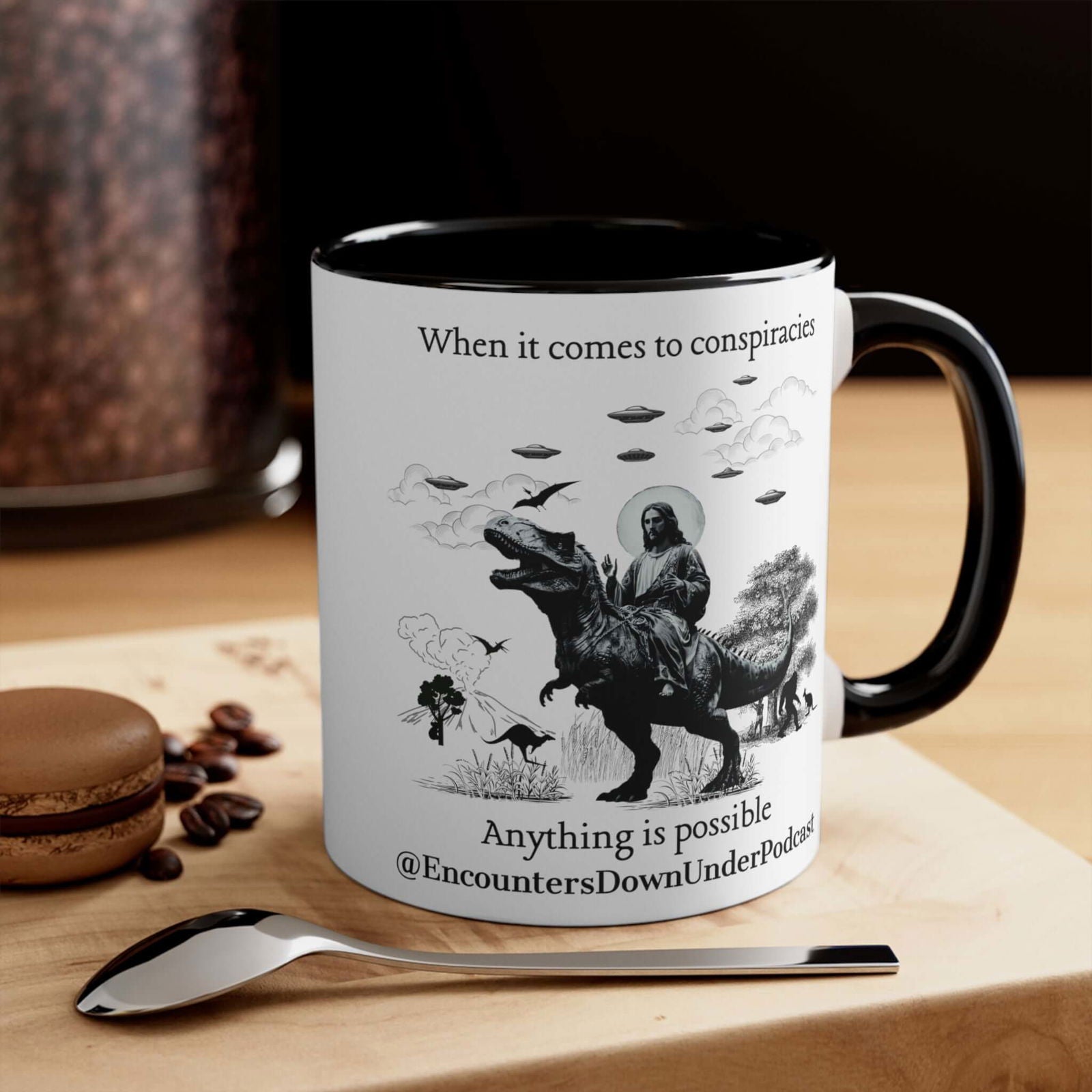 Encounters Down Under Podcast Supporting UFO Mug - Jesus Riding Dinosaur Mug Printify 11oz Black