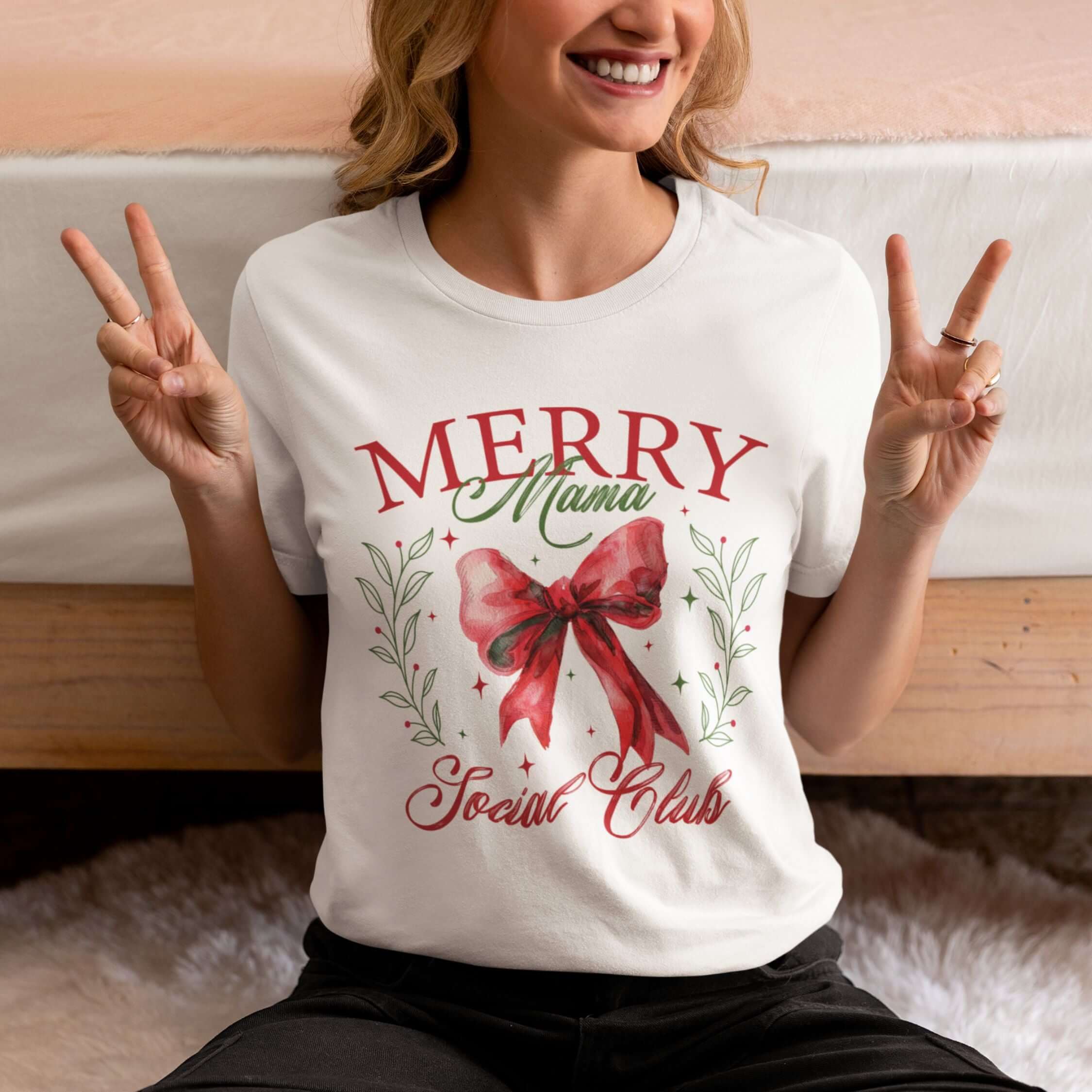 Merry Mama Social Club: Coquette Bow Christmas T-Shirt T-Shirt Printify