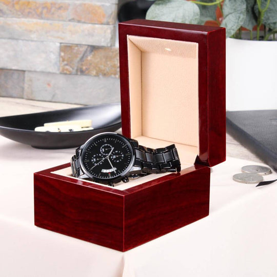 Engraved watch for boyfriend displayed in a stylish wooden gift box on a table.