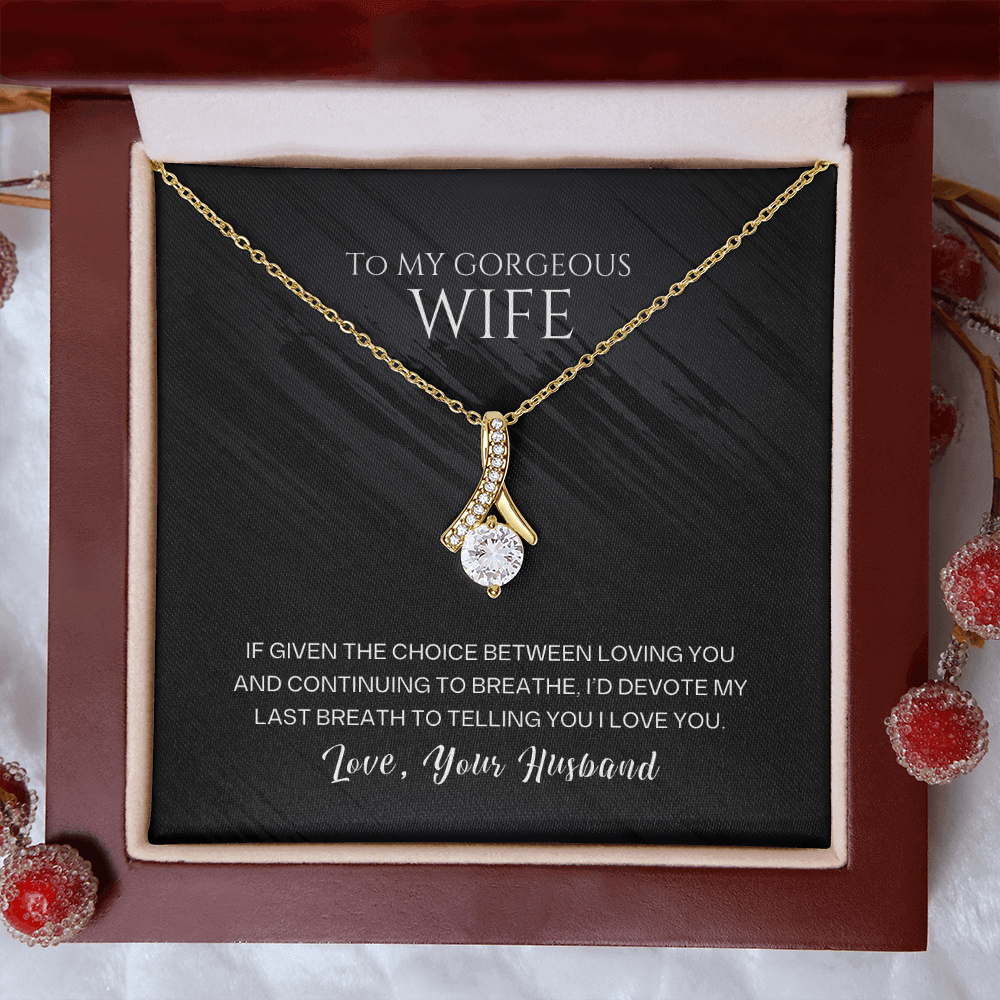 Sentimental birthday jewelry gift for her featuring a gold necklace with a sparkling pendant in a beautiful gift box.