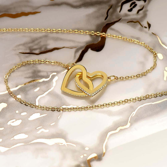 Luxury soulmate connection jewelry parents to daughter keepsake with interlocking gold hearts design.