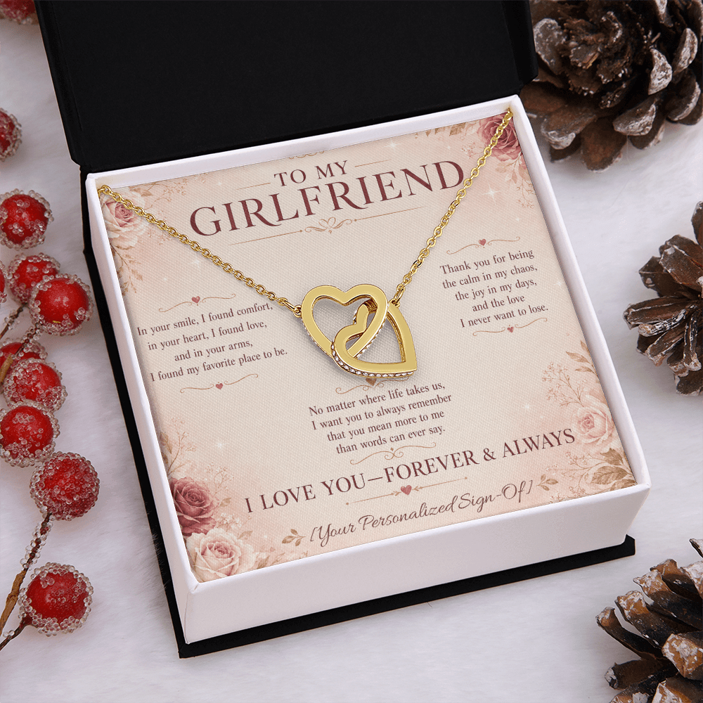 Interlocking hearts necklace for girlfriend presented in a gift box with a heartfelt message card.