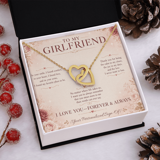Interlocking hearts necklace for girlfriend presented in a gift box with a heartfelt message card.