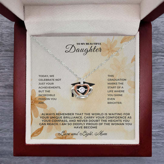 Sentimental keepsake jewelry for daughter presented in a graduation gift box with heartfelt message.