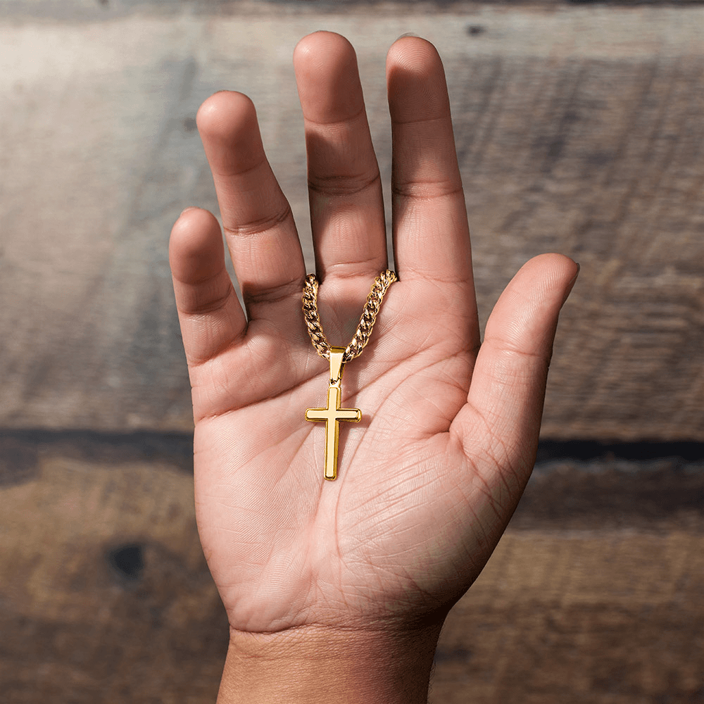 Graduation Gift: Personalized Engravable Cross Necklace held in hand with Cuban chain