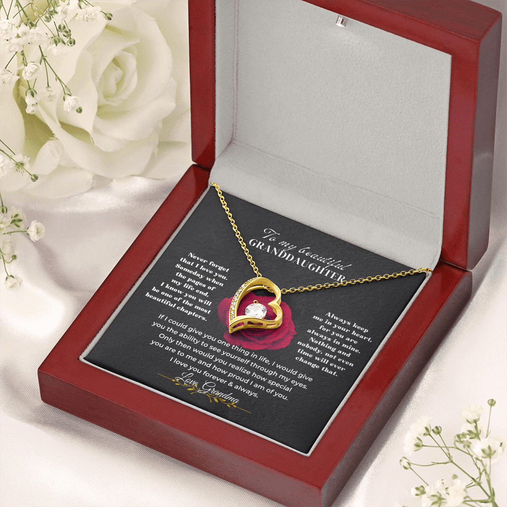 Meaningful granddaughter jewelry gift set featuring a heart-shaped necklace in a red box with sentimental message.